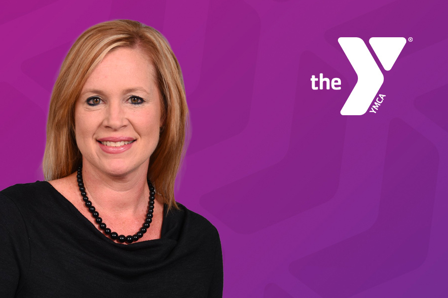 Headshot of Karen Brown in front of purple chevron background