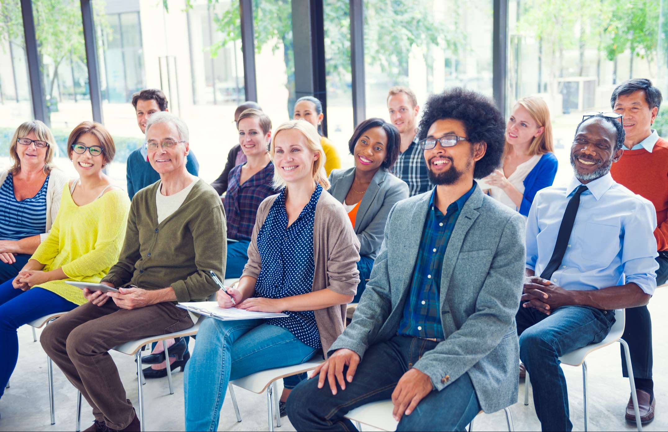 Large group of people listening to a seminar